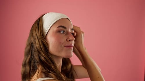 Closeup Studio Decorate Pink Background Beautiful Girl in Underwear Stands Puts on Cosmetic Headband