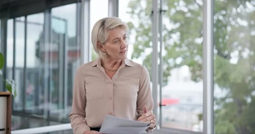 Businesswoman Leads Meeting with Young Adults in Office