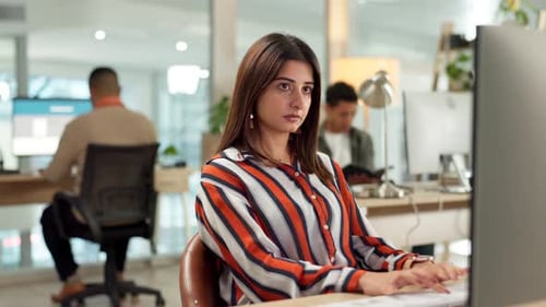 Woman Working on Computer in Modern Office