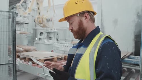 Marble Plant Worker Using Digital Tablet