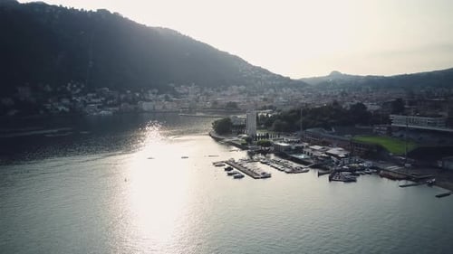 Captivating Aerial View of Lombardy's Lakeside City Como Port with Boats Scenic Mountains and