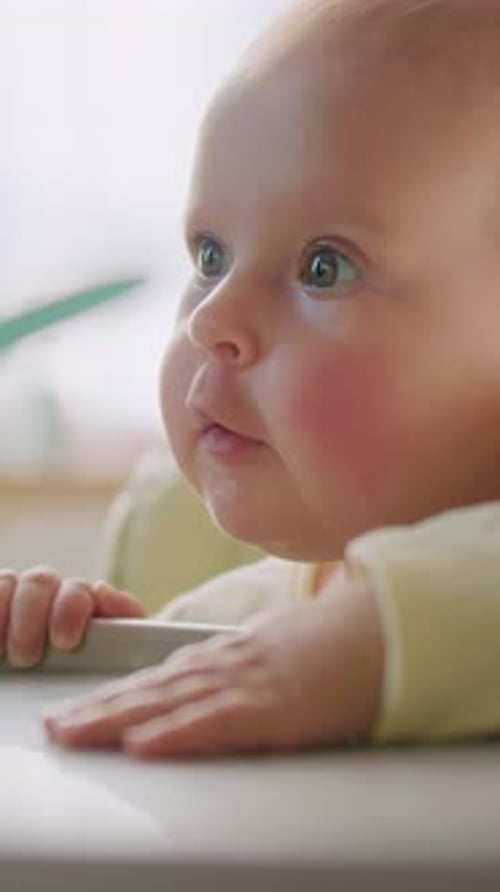 Charming Close-Up of a Baby in a High Chair