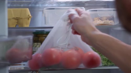 Refrigerator Interior with Food Containers and Produce