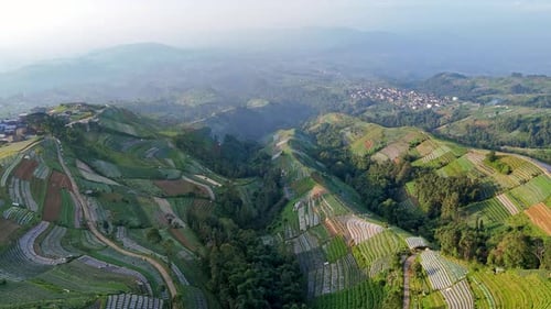 Stunning aerial scenery of cultivated mountain slopes and traditional countryside