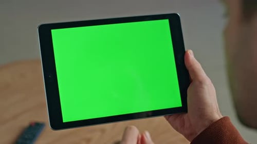 Unknown Businessman Using Chroma Key Tablet for Surfing on Workplace Closeup