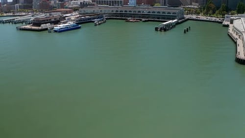 Aerial tilting up shot to reveal the San Francisco Ferry Building on a clear day. 4K
