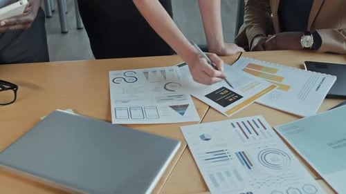 Business Team Reviewing Data at Office Table