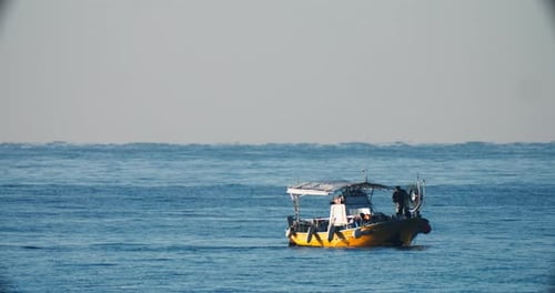Fishing Boats in the Open Sea Catch Fish