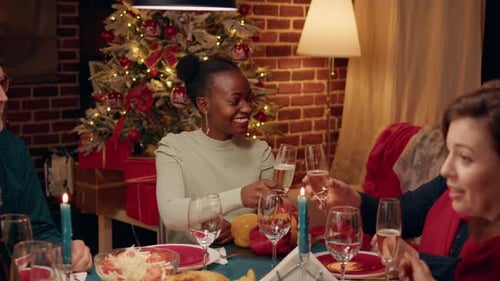 Friends and Family Celebrate Christmas With a Champagne Toast