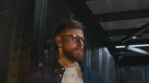 Young Professional IT Specialist Maintaining Hardware Work in Data Center