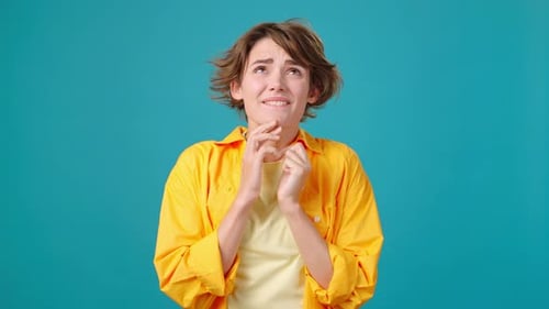 Woman Makes Wish Showing Prayer Gesture and Crossing Fingers