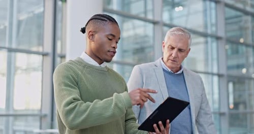 Tablet, discussion and manager talking to a businessman on a corporate project in the office