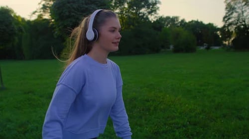 Young woman rollerblading in the park