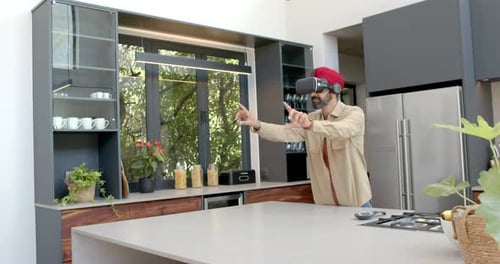Man Uses VR Headset in Modern Kitchen