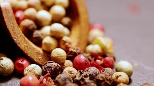 Colorful Mix of Peppercorns in Wooden Spoon