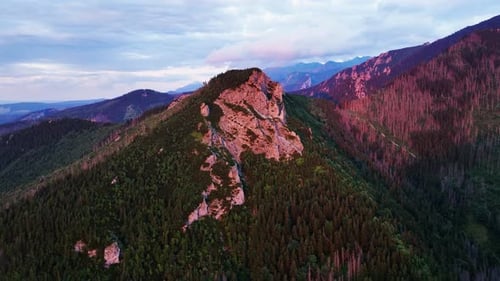 Aerial view at the top of the mountain illuminated by the sunset, stunning view.