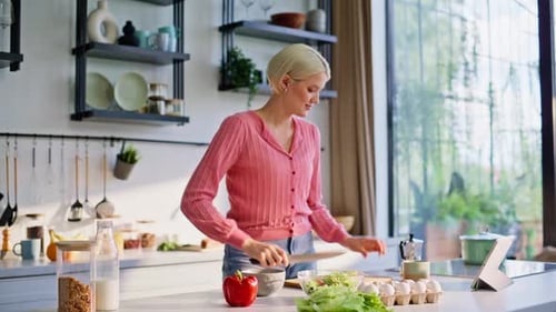 Woman Preparing Healthy Salad in Modern Kitchen