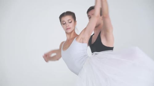 Graceful Ballet Dancers Performing Together in Studio
