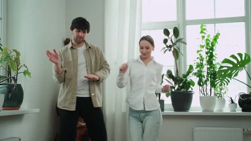 Young Couple Dancing Together at Home
