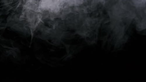 Jet Stream of Smoke or Vapor on Black Background in Slow Motion