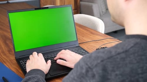 green screen laptop working home