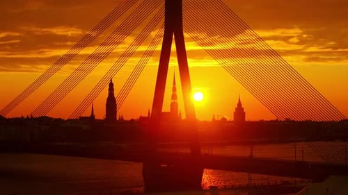 Morning Sun Over Daugava River And Historic Riga Silhouettes From Drone View