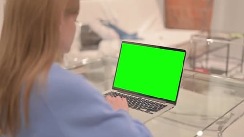 Businesswoman Using Laptop with Green Screen