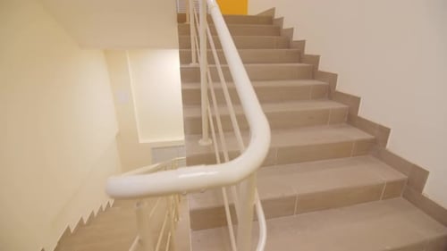 Clean Staircases with Railings in Residential Building