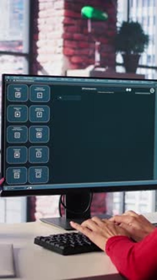 Vertical Video Focused Woman Working with an AI Chatbot on Her Desktop Computer