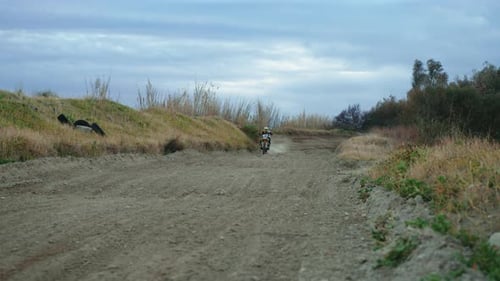 Motocross Running on the Dirt Street for a Race