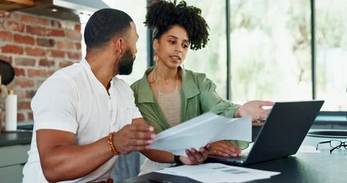 Couple Working on Laptop in Modern Kitchen