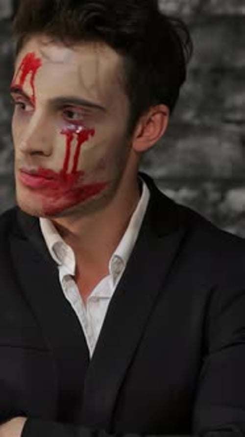 Frustrated Vampire Checks the Time with a Fierce Glare