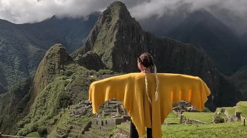 Woman Admiring Machu Picchu Ruins in Peru