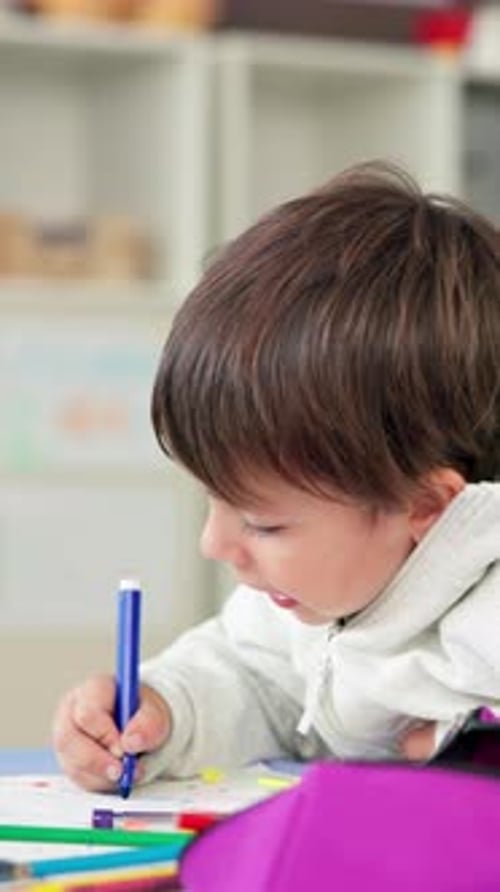 Color, education and child with drawing in classroom for creativity, growth or development