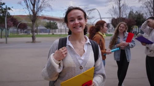 Redhaired College Boy Poses Smiling Looking at Camera Outside Life on Campus During Exam Time