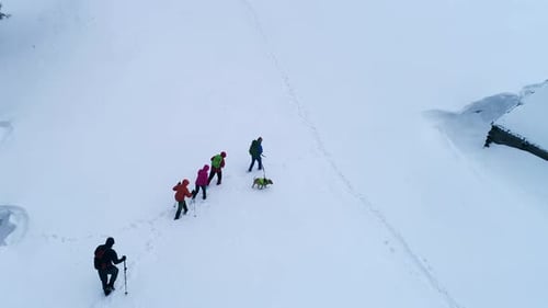 Touristse Hiking in the Mountains in Winter