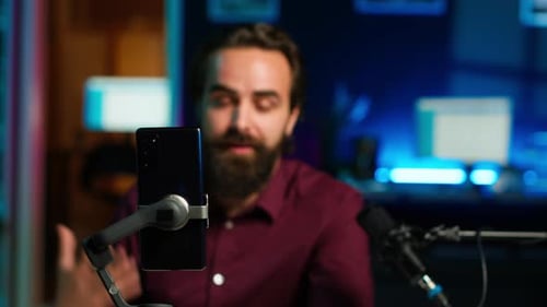 Focus on Cellphone Used By Media Star Using on Selfie Stick to Film Vlog