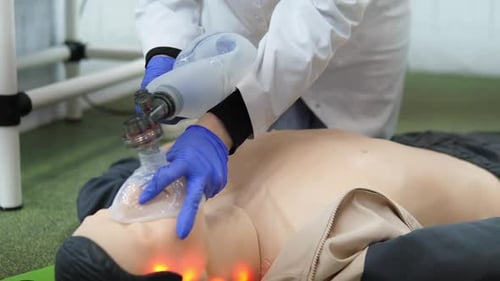 Medical Dummy Being Ventilated by Professional Wearing Gloves