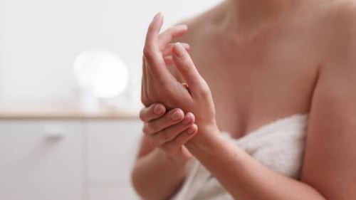 Beauty treatments, Business woman Happily Smoothes the skin of her arms and legs In the spa