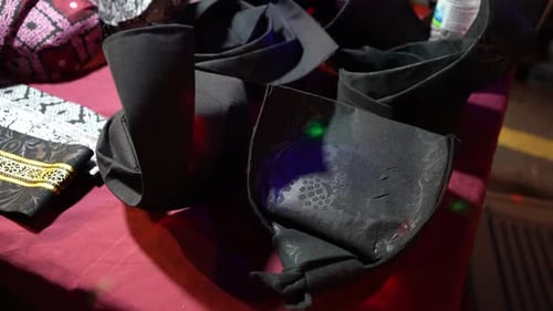 Collection of Black Hats on Table