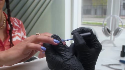 Periwinkle Nail Polish Application During Manicure