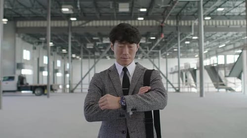 Confident Property Owner Portrait in Warehouse