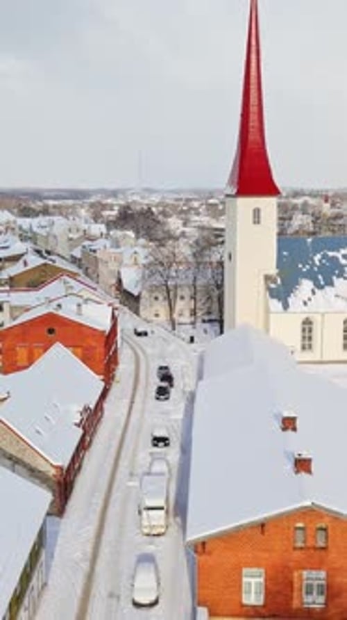 Vertical aerial of snowy streets and the church, winter day in Rakvere, Estonia