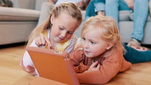 Tablet, search and sisters on a floor with cartoon, games or video, fun