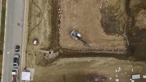 Aerial View TimeLapse of Excavators Digging Foundation on a Construction Site