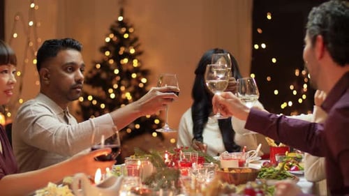 Friends Celebrating Holiday at Festive Dinner Table
