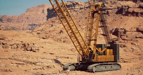 Heavy Construction Crane Operates in Arid Desert Landscape for Mining Projects