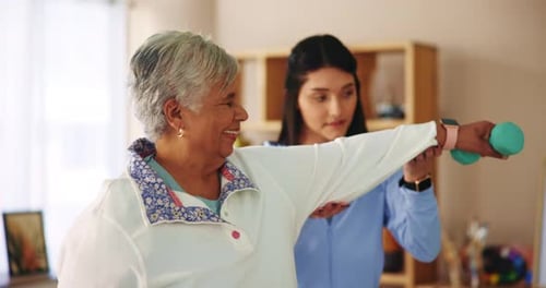 Senior Woman Doing Physical Therapy with Assistant
