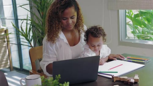 Mother and Child Drawing Together at Home