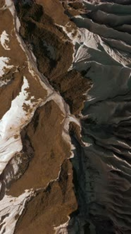 Aerial of Wide Gorge with Rocky Cliffs From Both Sides of Small Canyon Clip Stone Slopes and Yellow